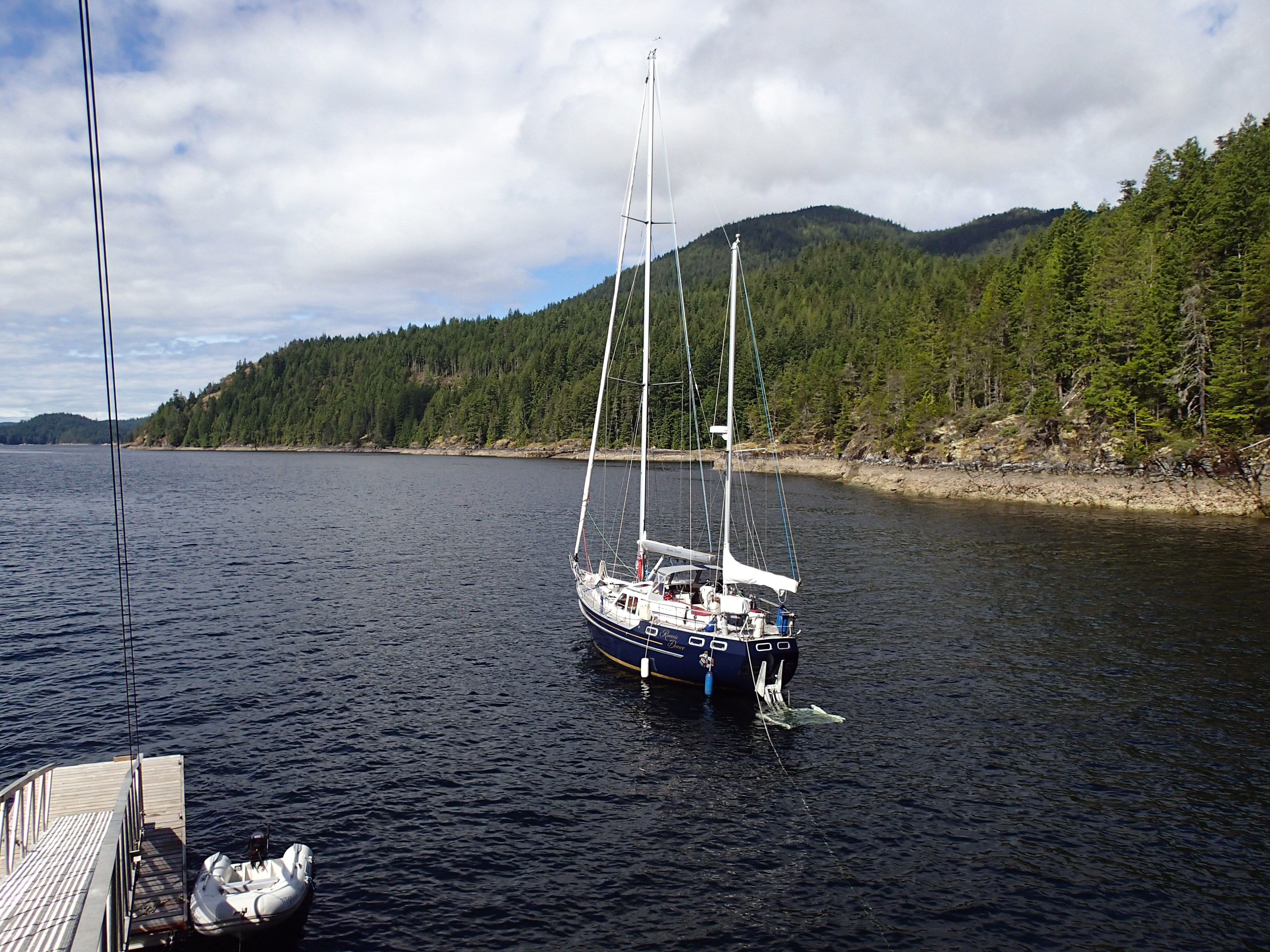 Raven's Dance anchored in a peaceful cove